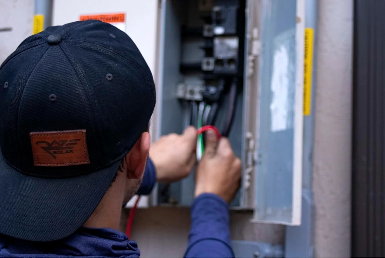 Electrician troubleshooting a residential panel