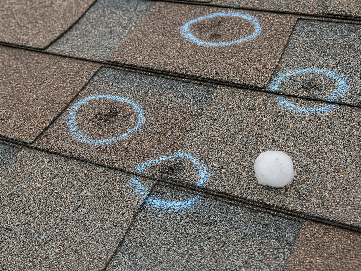 Hail damage inspection with chalk circles on shingles