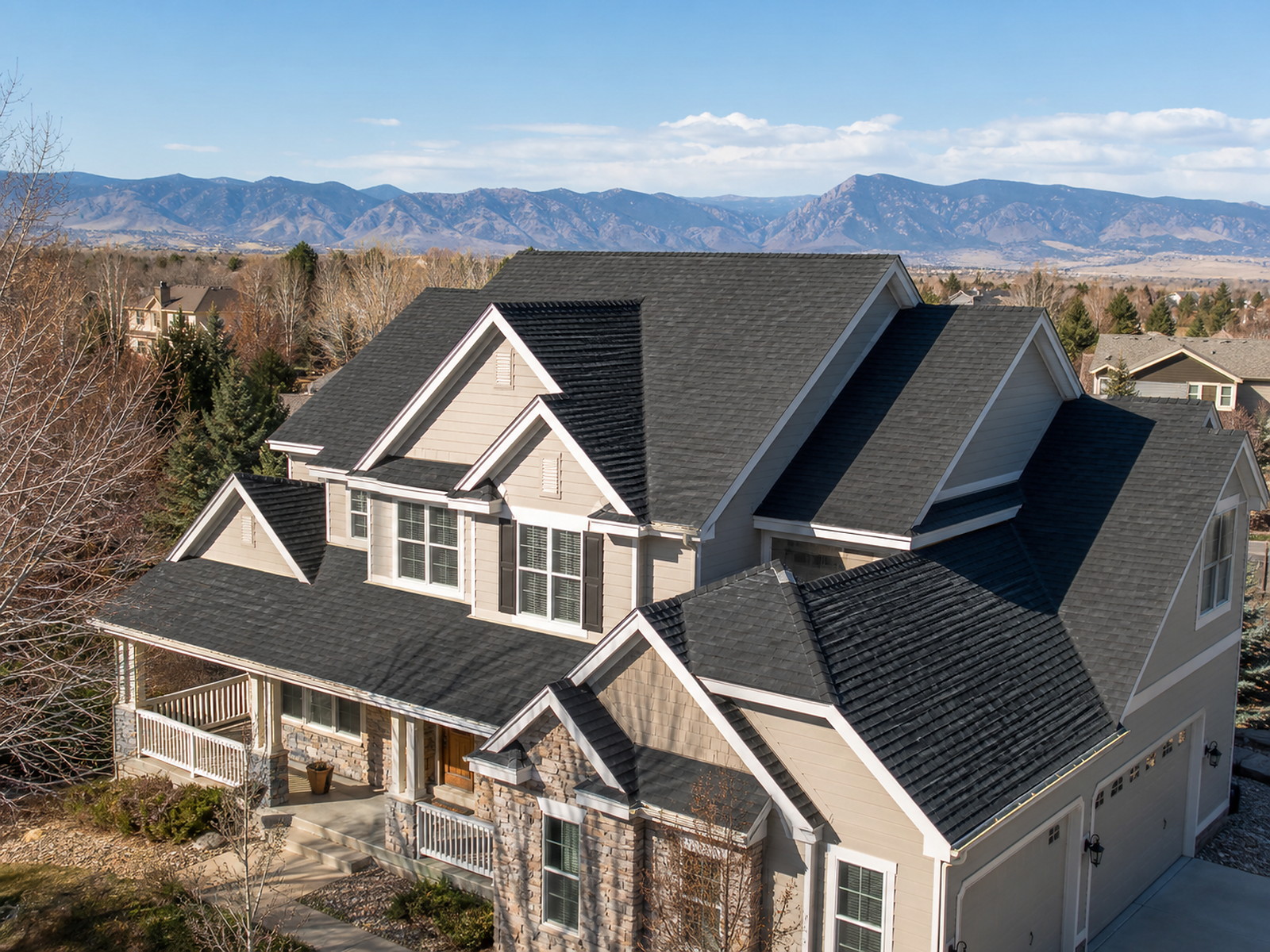 Completed charcoal shingle roof on a Highlands Ranch two-storey home