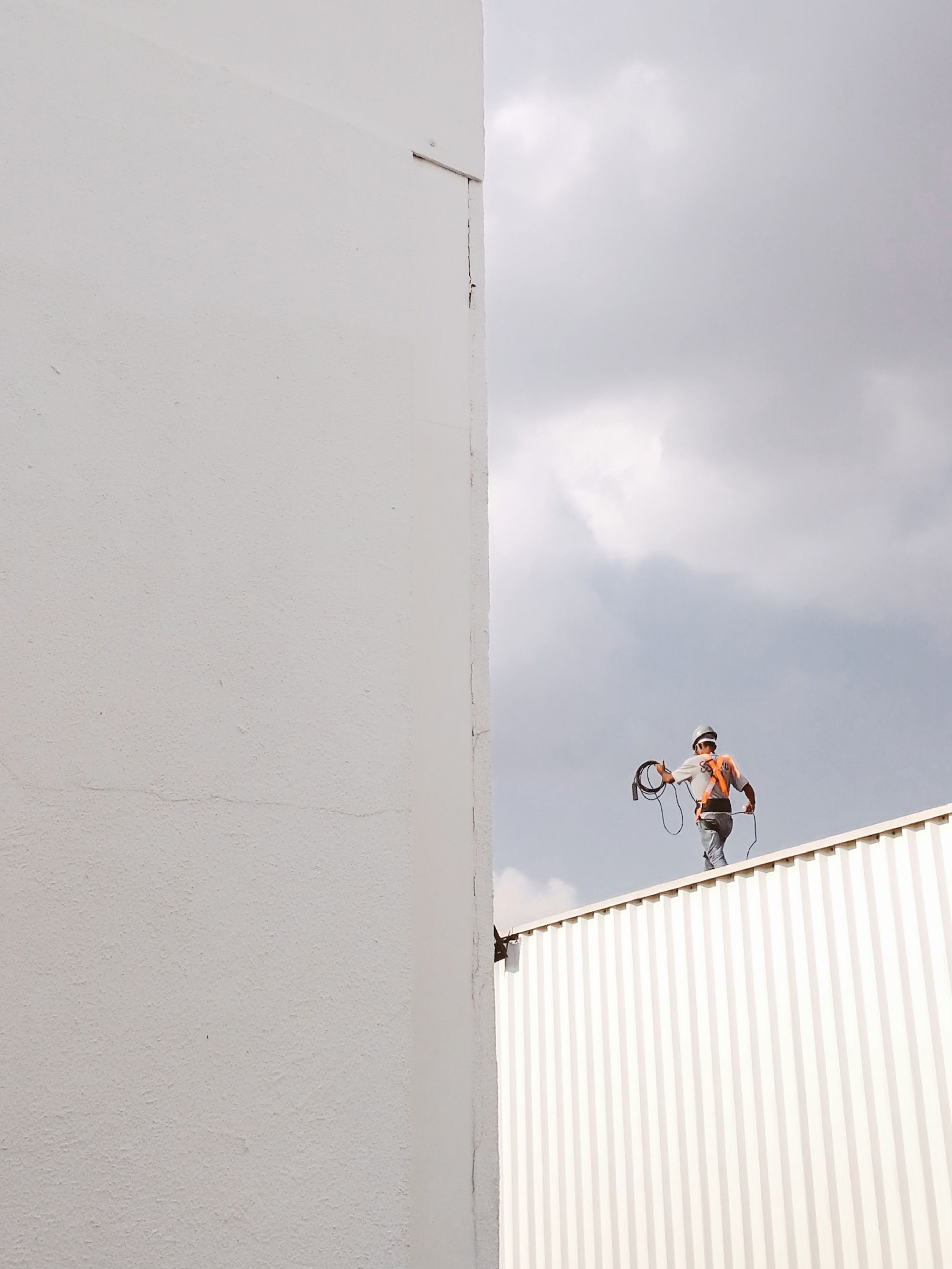 Construction professional working on a roof
