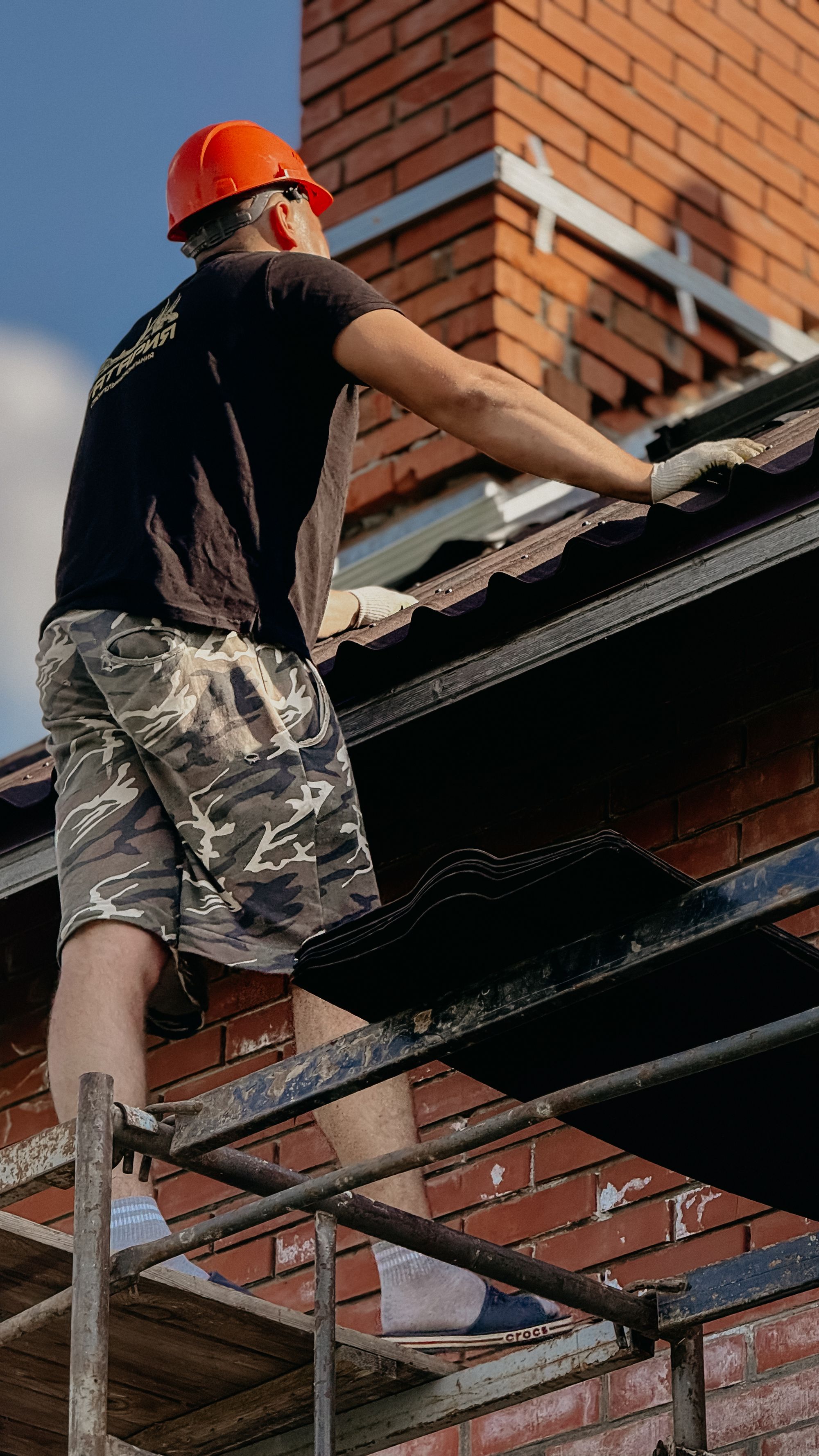 A roofer completing a detailed roof inspection